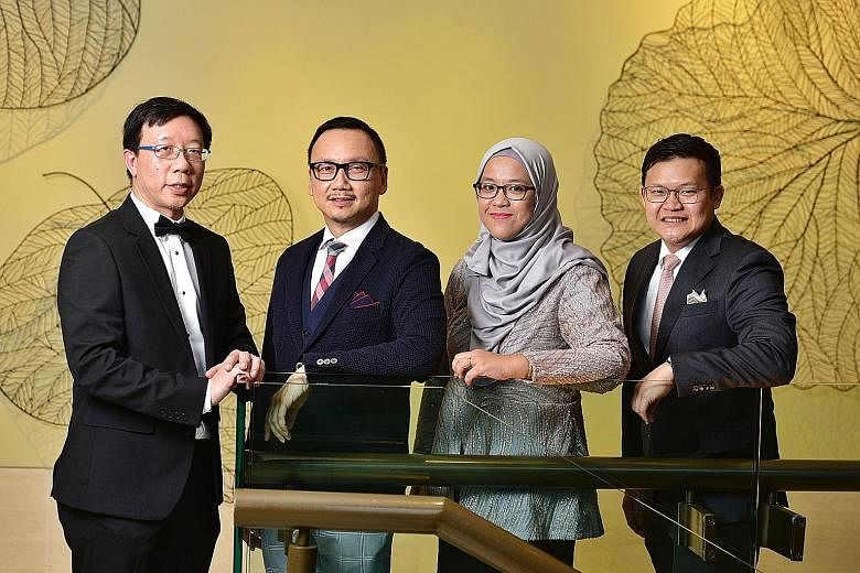 (From left) St Luke's Hospital CEO Tan Boon Yeow, who won the National Outstanding Clinician Educator Award; National Healthcare Group Eye Institute medical director Wong Hon Tym; senior manager Haslina Hamzah of the Singapore National Eye Centre (SN