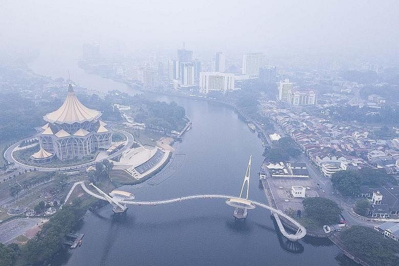Hazy conditions yesterday in Kuching, Sarawak, where the air quality index was 155 in the evening, in the unhealthy range. PHOTO: THE STAR/ASIA NEWS NETWORK