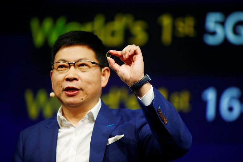 Huawei's consumer head Richard Yu presenting the new Kirin 990 (5G) chipset at the IFA consumer tech fair in Berlin, Germany, yesterday. Other chipmakers are also racing to build 5G integrated mobile chipsets. PHOTO: REUTERS