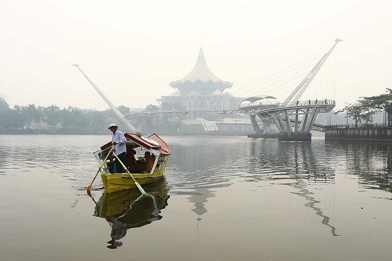 The State Legislative Assembly complex in Kuching shrouded in haze yesterday morning. The Sarawak capital registered an Air Pollutant Index reading of 216, in the very unhealthy range, at 2pm yesterday.