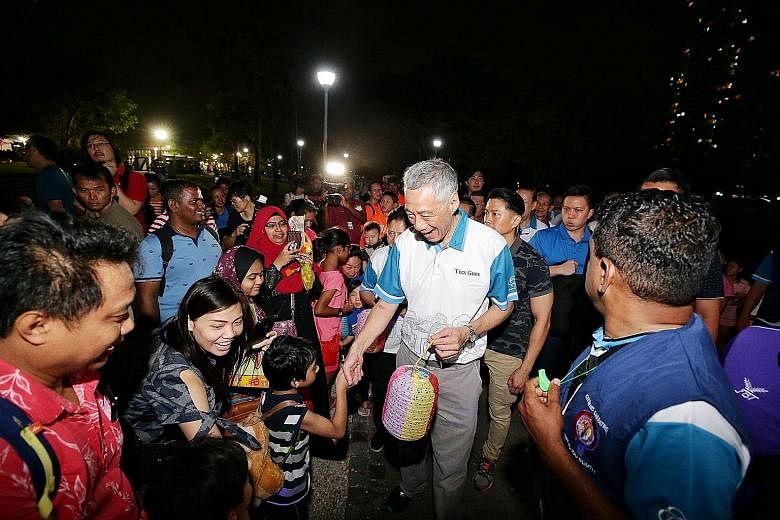 Quirky lanterns made from recycled materials illuminated Bishan-Ang Mo Kio Park last night, where hundreds of Teck Ghee residents gathered to celebrate the Mid-Autumn Festival. 	Joining them were Prime Minister Lee Hsien Loong and his wife. Some resi
