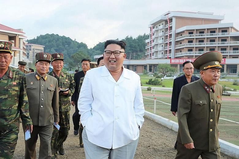 An undated photo from North Korea's Korean Central News Agency showing leader Kim Jong Un inspecting a construction site in Yangdok county. North Korean officials have criticised the US' position that sanctions against Pyongyang will not be lifted un