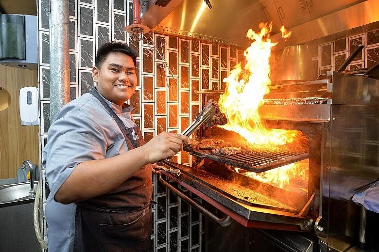 Chef Syahir Osman using the Mibrasa oven, which is designed to ensure that the airflow is constant and the temperature is kept regulated - and sparks do not land on the user.