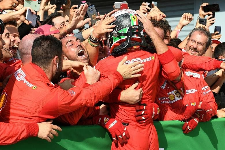 Charles Leclerc being mobbed by Ferrari staff after winning the Italian Grand Prix yesterday. With his second straight win, he overtakes teammate Sebastian Vettel to move into fourth, three points behind Red Bull's Max Verstappen.