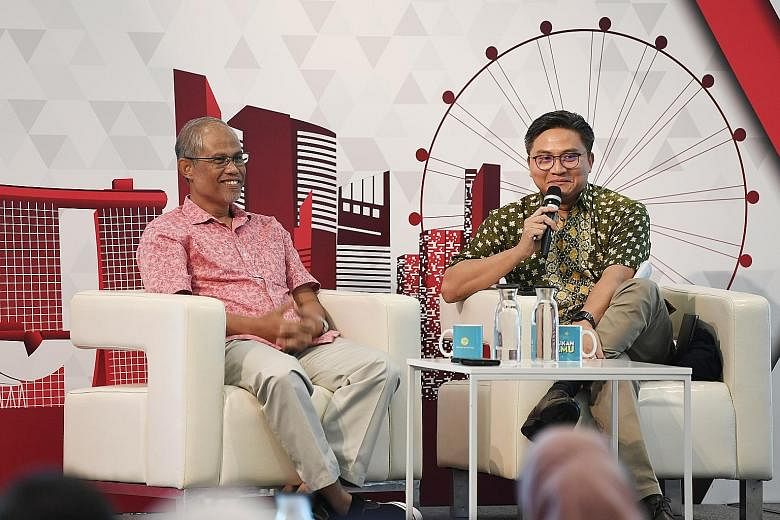 Minister-in-charge of Muslim Affairs Masagos Zulkifli (left) and MP Saktiandi Supaat at the dialogue yesterday.