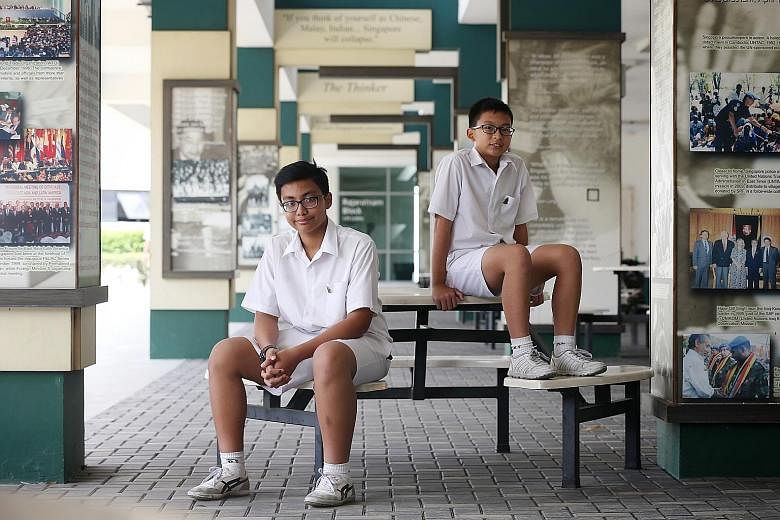 Raffles Institution students Muhammad Aqil Ahmad (left) and Joash Lim received the Raffles Scholarship in primary school and later entered RI. But they are the exception, as the number of scholarship recipients who go on to join the institution has r