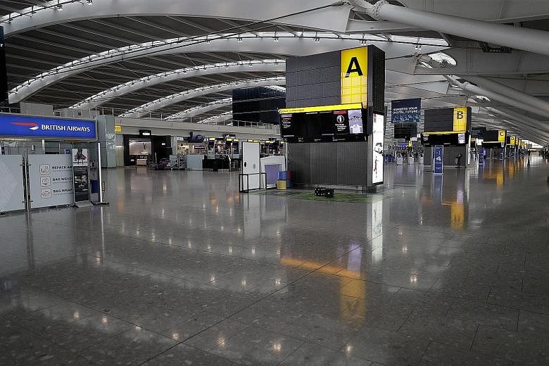 A nearly empty Terminal 5 yesterday at Heathrow Airport in London, which handles British Airways flights, at the beginning of a two-day strike. The airline has offered its pilots an 11.5 per cent pay rise over three years, but the British Airline Pil