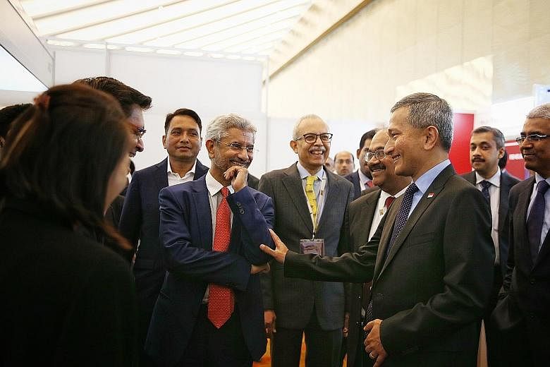 Foreign Minister Vivian Balakrishnan chatting with his Indian counterpart Subrahmanyam Jaishankar (in red tie) at the India Singapore Business and Innovation Summit yesterday. Singapore has been involved in the capital city project of Amaravati in An