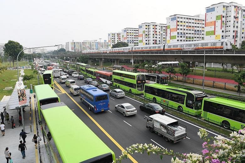 Long lines of buses on both sides of the road in front of the new Yishun Integrated Transport Hub at around 5.50pm yesterday. The Land Transport Authority, which earlier implemented measures such as widening the roads and adjusting traffic-light timi