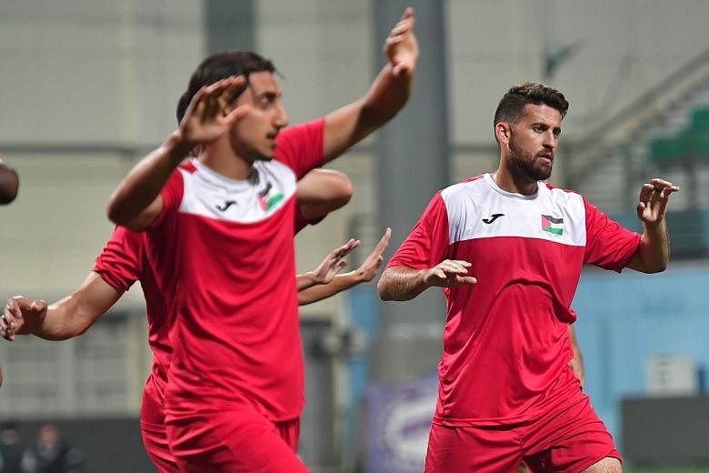 Midfielder Nazmi Albadawi (right), born in the United States, is one of the Palestinian players based overseas.