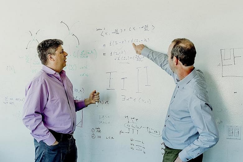Dr Oren Etzioni (left) oversees the Allen Institute for Artificial Intelligence, which is behind Aristo, a new system that answered correctly more than 90 per cent of the questions on an eighth-grade science test. He is with Mr Peter Clark, manager o