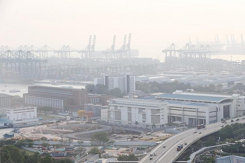 The hazy view of Pasir Panjang Terminal in southern Singapore at around 5.50pm yesterday. The National Environment Agency said hazy conditions are expected to continue over the next few days. ST PHOTO: JASON QUAH