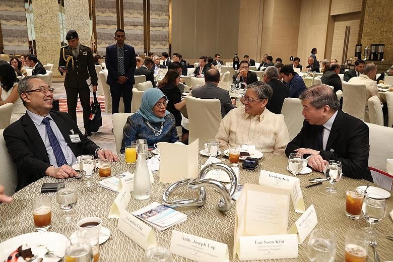 President Halimah Yacob with (from left) Mr Guillermo Luchangco from the Philippines-Singapore Business Council, Makati Business Club chairman Edgar Chua, and Singapore Business Federation chairman Teo Siong Seng at yesterday's 14th Philippines-Singa