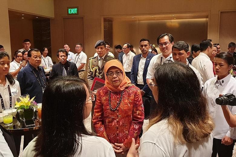 President Halimah Yacob meeting participants of Faiths@Work, a regional network that brings together South-east Asians of different faiths to do humanitarian work, in Manila yesterday. Dialogue is essential to counter prejudice, intolerance and ignor