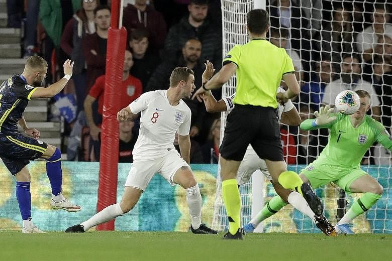 Kosovo's Valon Berisha scoring his side's second goal against England in Tuesday's Euro 2020 qualifier at St Mary's Stadium in Southampton. The Three Lions still ran out 5-3 winners and top Group A with 12 points from four games but their sloppy defe