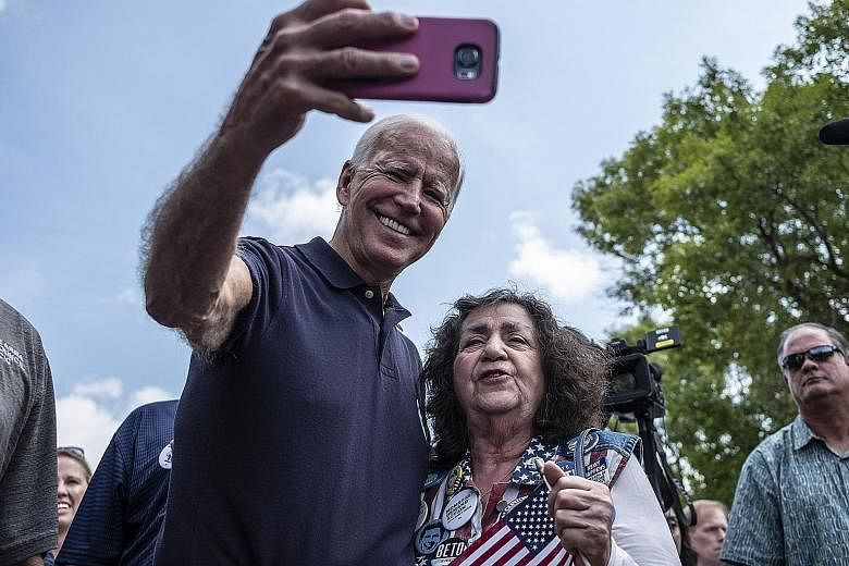 Mr Joe Biden with an attendee at a Labour Day picnic in Cedar Rapids, Iowa, on Sept 2. Despite leading in polls, he has been looking more fallible lately. PHOTO: NYTIMES