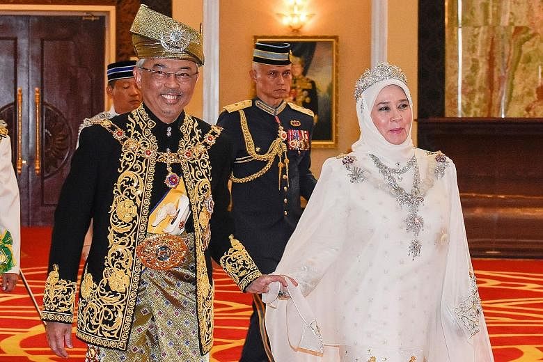 Malaysia's King, Sultan Abdullah Ri'ayatuddin, with his consort, Tunku Azizah Aminah Maimunah Iskandariah, during his coronation on July 30. PHOTO: AGENCE FRANCE-PRESSE