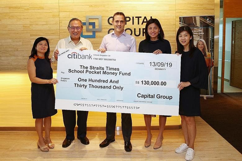 (From left) The Straits Times School Pocket Money Fund's general manager Tan Bee Heong; its treasurer Gerard Ee; Capital International Investors vice-president Jonathan Wright; Capital Research Global Investors partner Katherine Wee; and Capital Internati