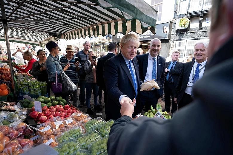 Britain's Speaker of Parliament John Bercow (above) has warned Prime Minister Boris Johnson not to disobey the law by refusing to ask the European Union for a Brexit delay. Mr Johnson (fourth from right, at a visit to Doncaster Market in Doncaster, y