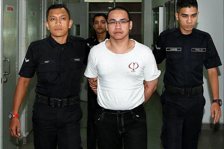 Poon Wai Hong was accused of murdering teenager Ng Yuk Tim on Oct 21, 2013, and dumping the suitcase containing her body in Shah Alam. PHOTO: THE STAR/ASIA NEWS NETWORK