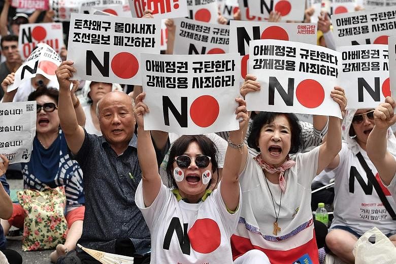 South Koreans rallying in Seoul against Japan's decision to remove their country from its list of preferred trading partners last month. South Korea is set to announce its decision to officially exclude Japan from its own "white list" of trusted expo
