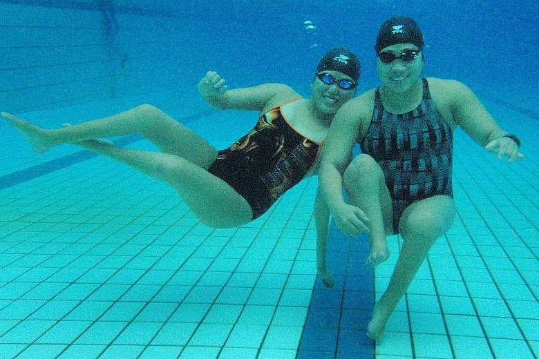 Long-time friends Yip Pin Xiu and Theresa Goh back in 2011. The younger swimmer feels that the pair could click so well because they "understood each other's journeys" and were striving "to reach common goals". ST FILE PHOTO