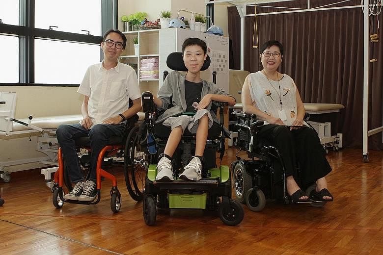From left: Mr Alvin Seah, 39, Mr Desmond Lam, 19, and Ms Sherena Loh, 59, who all have a form of muscular dystrophy, at the Muscular Dystrophy Association (Singapore). The centre needs more funds to continue running and expanding its programmes, whic