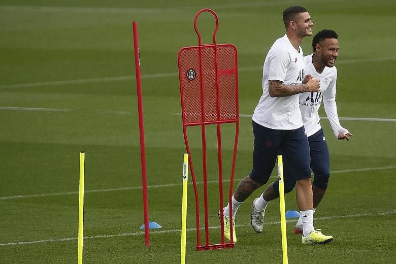 Paris Saint-Germain forwards Mauro Icardi (left) and Neymar training ahead of their Champions League opener against Real Madrid today at the Parc des Princes. Icardi will be tasked with leading the attack, with fellow attackers Neymar suspended while