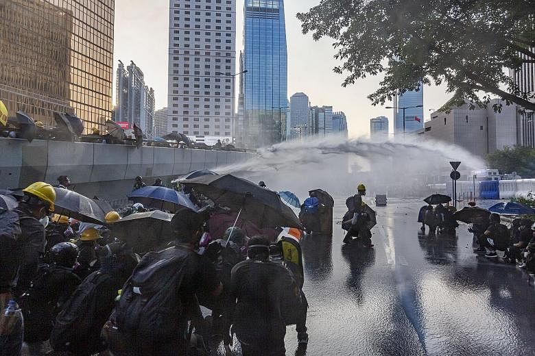 Hong Kong police using water cannon on protesters on Sunday. As protests stretch into the fourth month, new digital banks, seen triggering the biggest shake-up in Hong Kong's retail banking sector in years, will now be launched early next year, sourc