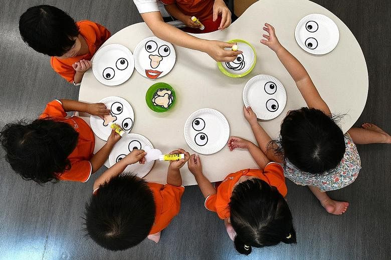 Pre-schoolers making face masks at My First Skool in Boon Lay Drive. Anchor and partner operators of childcare centres get government funding to keep fees low, and have a fee cap to adhere to. The fee cap is $720 for anchor operators and $800 for par