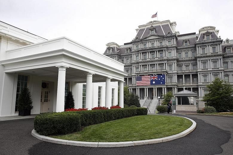 United States and Australian flags hang from the Eisenhower Executive Office Building, ahead of Australian Prime Minister Scott Morrison's state visit to the US.