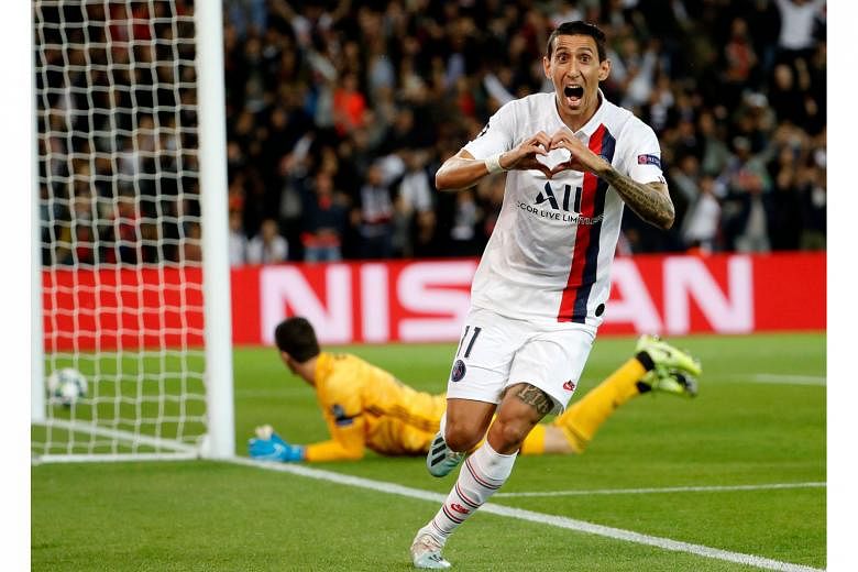 Argentinian midfielder Angel di Maria showing his love after scoring Paris Saint-Germain's first goal in the Champions League tie against Real Madrid at the Parc des Princes on Wednesday night. He added the second and defender Thomas Meunier wrapped 
