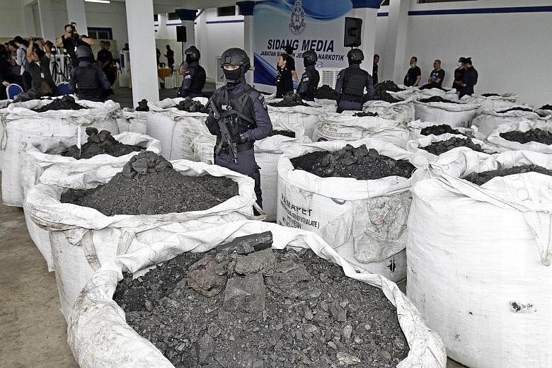 The sacks of coal mixed with cocaine are believed to have arrived at Butterworth port on Aug 16. Police Inspector-General Abdul Hamid Bador said the cocaine was valued at RM200,000 per kg. PHOTO: THE STAR/ ASIA NEWS NETWORK