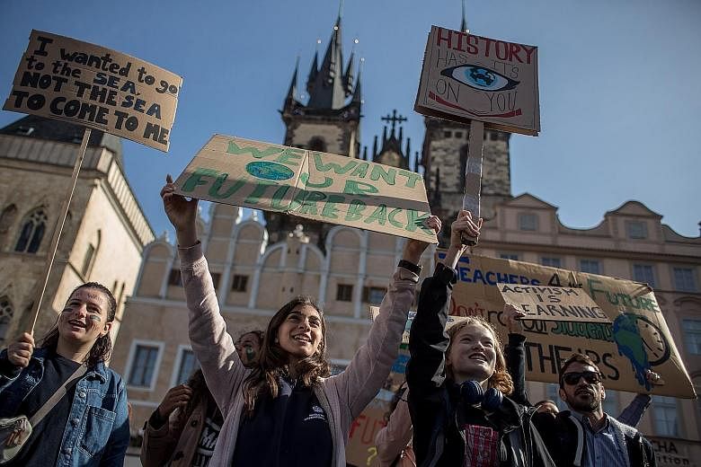 CZECH REPUBLIC: Young people at Prague's Old Town Square in one of the hundreds of rallies that took place across Europe yesterday.