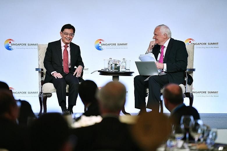 Deputy Prime Minister Heng Swee Keat at a dialogue with moderator Nik Gowing at the Singapore Summit at Shangri-La Hotel yesterday. ST PHOTO: LIM YAOHUI