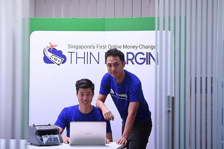 Mr Alstone Tee (left) and Mr Tan Jin of local fintech start-up Thin Margin. Firms like theirs have a much wider reach.
