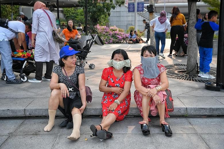 Vietnamese tourists wearing masks in Singapore last week.