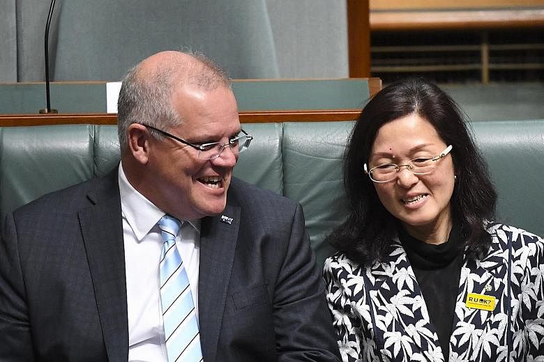 Australian Prime Minister Scott Morrison with Australia's first Chinese-born MP Gladys Liu. The controversy has proven damaging for Mr Morrison, especially since he relies on Ms Liu, who was born in Hong Kong, to maintain his razor-thin majority in t
