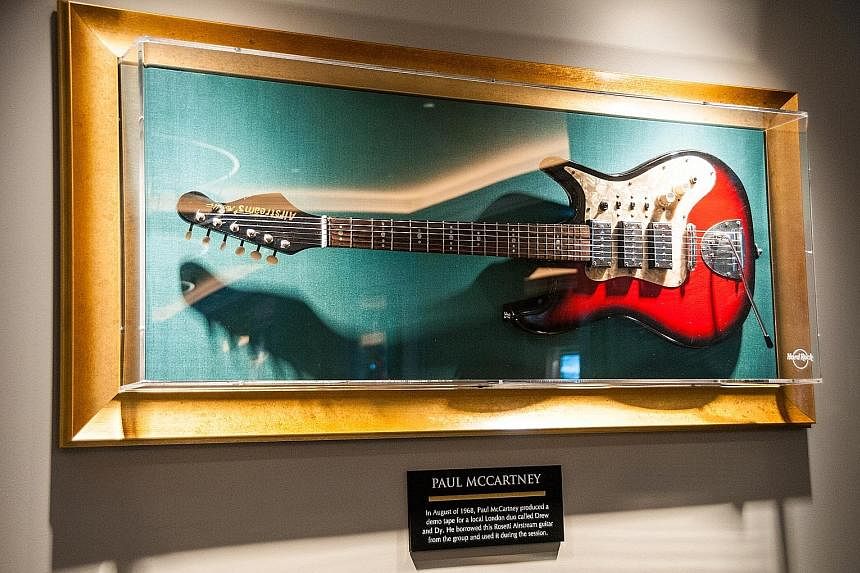 A Rosetti Airstream guitar (above) played by Paul McCartney on a demo tape for the duo Drew & Dy on display at the Hard Rock Hotel London.
