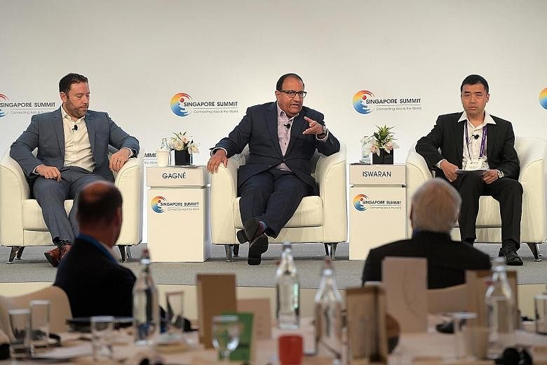 Mr S. Iswaran, Minister for Communications and Information, at the panel discussion of the annual Singapore Summit with Mr Jean-Francois Gagne (left), chief executive of software firm Element AI, and Professor Xue Jun (right) of Peking University Law