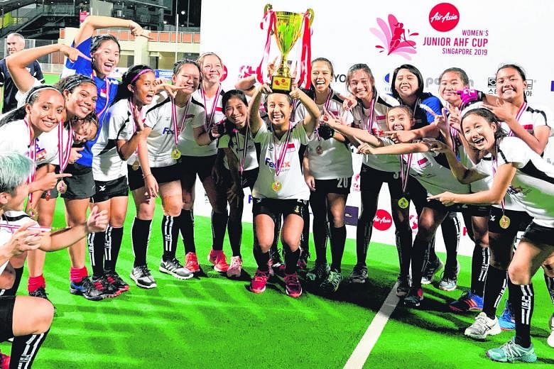The victorious Singapore team, celebrating winning the Women's Junior AHF Cup at the Sengkang Hockey Stadium last week.