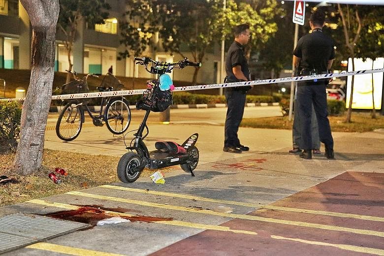 Photographs of the scene of the accident in Bedok North show bloodstains on the pavement next to the cycling path. PHOTO: SHIN MIN DAILY NEWS