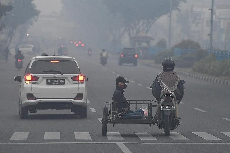 Haze shrouding Pekanbaru town on Saturday. The PM10 Pollutant Standards Index surged past 700 at 10pm yesterday, the highest it has ever reached, surpassing the pollution levels during Indonesia's worst haze episode in 2015. Riau, in the central part