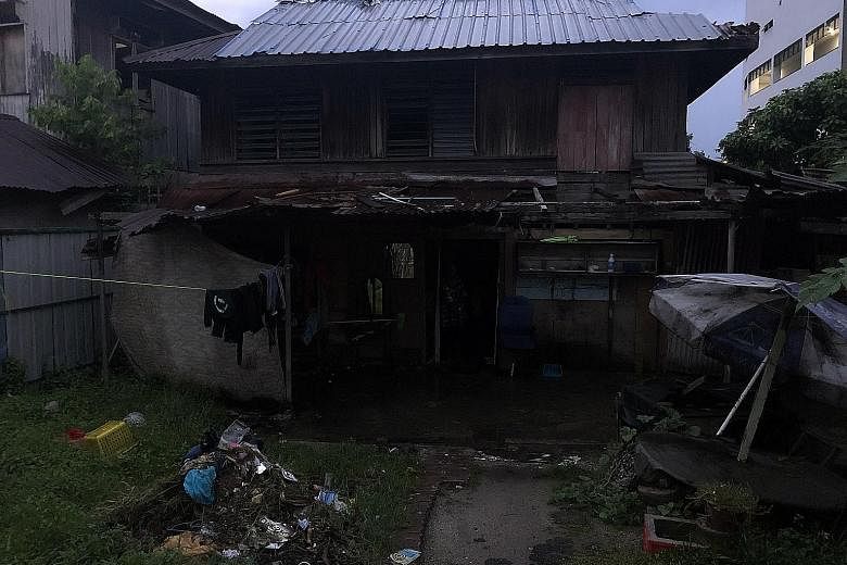 Above: Ms Kaliama Badmayiah, 38, who earns RM25 a day working as a cleaner, lives in an abandoned house (below left) with no power supply or running water. Below right: Ms Mary Santiago, 59, a widow who works as a cook in a food court. She earns bare