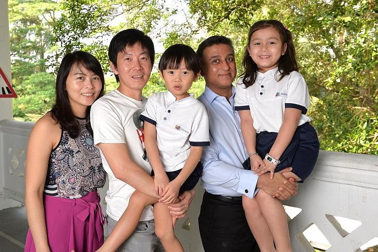 Mrs Emily Wong and Mr Matthew Wong with their five-year-old son Isaiah, along with Mr Sonny Panesar and his six-year-old daughter Akina. Isaiah and Akina attend Gate Junior in Dempsey, a learning centre for children with high IQ. The centre has more 