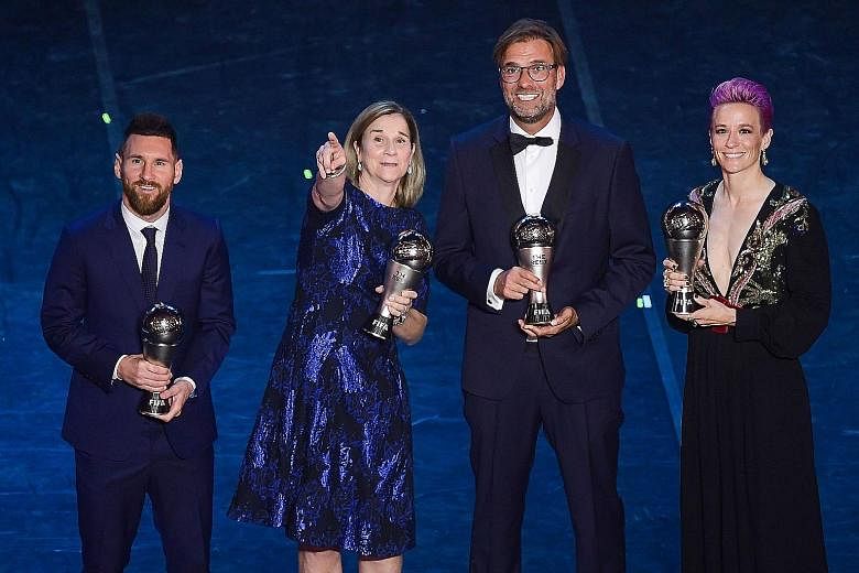 Lionel Messi and Megan Rapinoe posing with their awards in Milan on Monday night. It was Messi's sixth award and Rapinoe's first. Far right: Liverpool's Jurgen Klopp and USA head coach Jill Ellis won the men's Coach of the Year award and the women's 