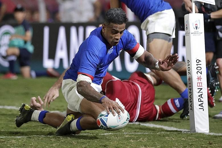 Rey Lee-lo scoring the fifth of Samoa's six tries in their 34-9 Pool A win over Russia in Kumagaya yesterday. He was one of two Samoan players sent to the sin bin for high tackles in the first half but his team recovered well from a 6-5 half-time def