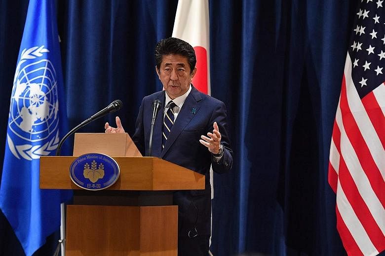 Japanese Prime Minister Shinzo Abe at a press conference on the sidelines of the United Nations General Assembly in New York on Wednesday. He has described just-inked deals with the US as a "win-win solution (that) will further galvanise investment b