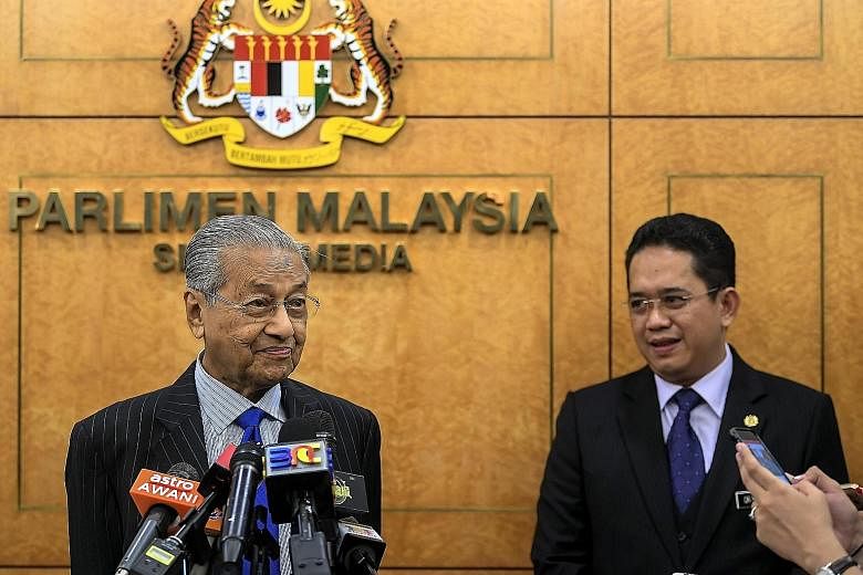 Malaysian Prime Minister Mahathir Mohamad with Deputy Unity Minister Farid Rafik, who died unexpectedly last Saturday. PHOTO: BERNAMA