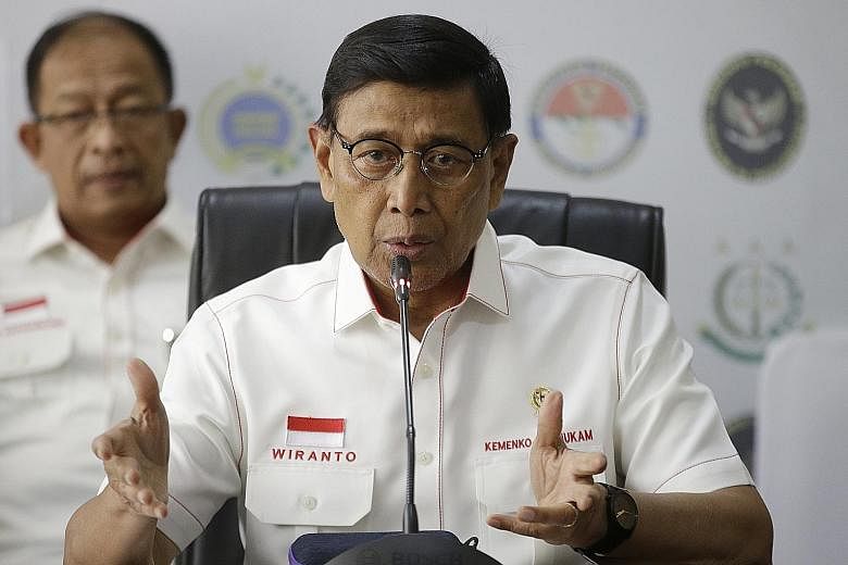 Coordinating Minister of Political, Legal and Security Affairs Wiranto met top officials yesterday to discuss the security situation. PHOTO: ASSOCIATED PRESS